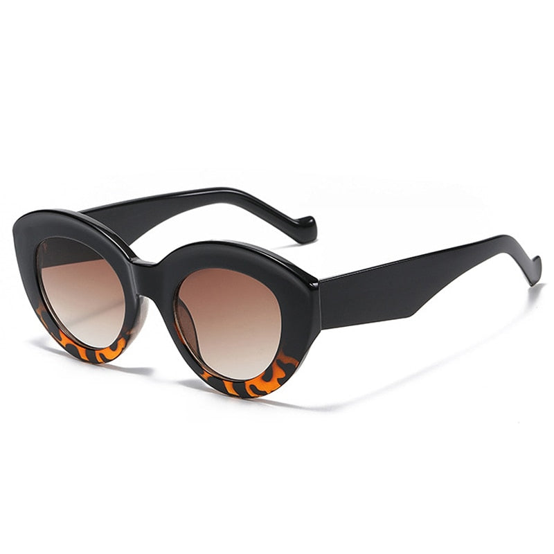 Playpark Claire Sunglasses feature a vintage cat eye with thick frames made from recycled materials and 400 UV protection - featured colour navy/torte.