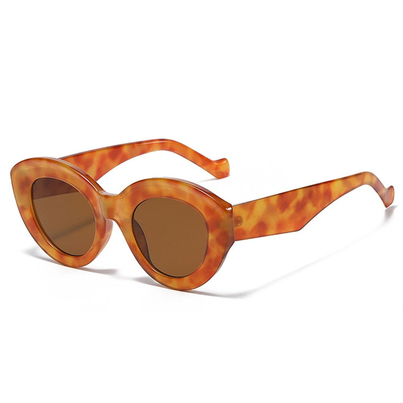 Playpark Claire Sunglasses feature a vintage cat eye with thick frames made from recycled materials and 400 UV protection - featured colour orange.