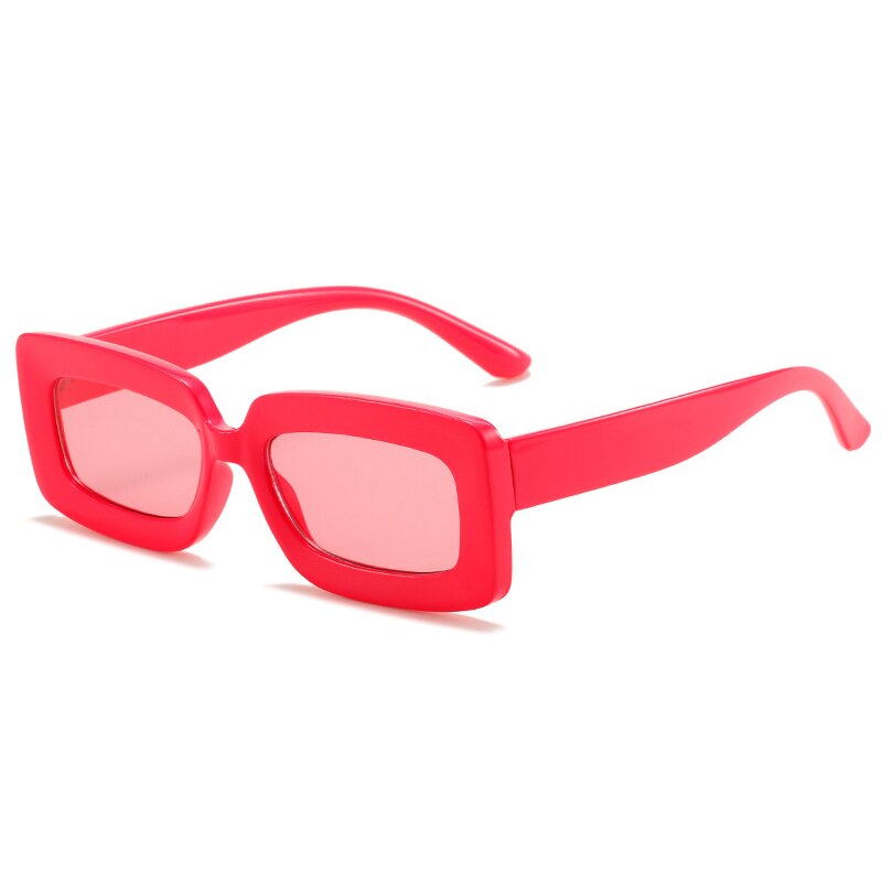 Playpark Alexa Sunglasses with transparent pink lenses and solid red candy coloured frames are made from 100% recycled plastic with UV400 protection lenses.