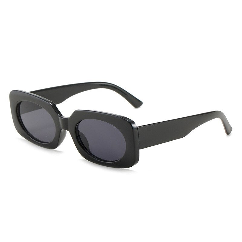 Playpark Atlas Sunglasses feature vintage style shapes and black transparent lenses and solid black colour frames. Made from recycled materials and 400 UV protection.