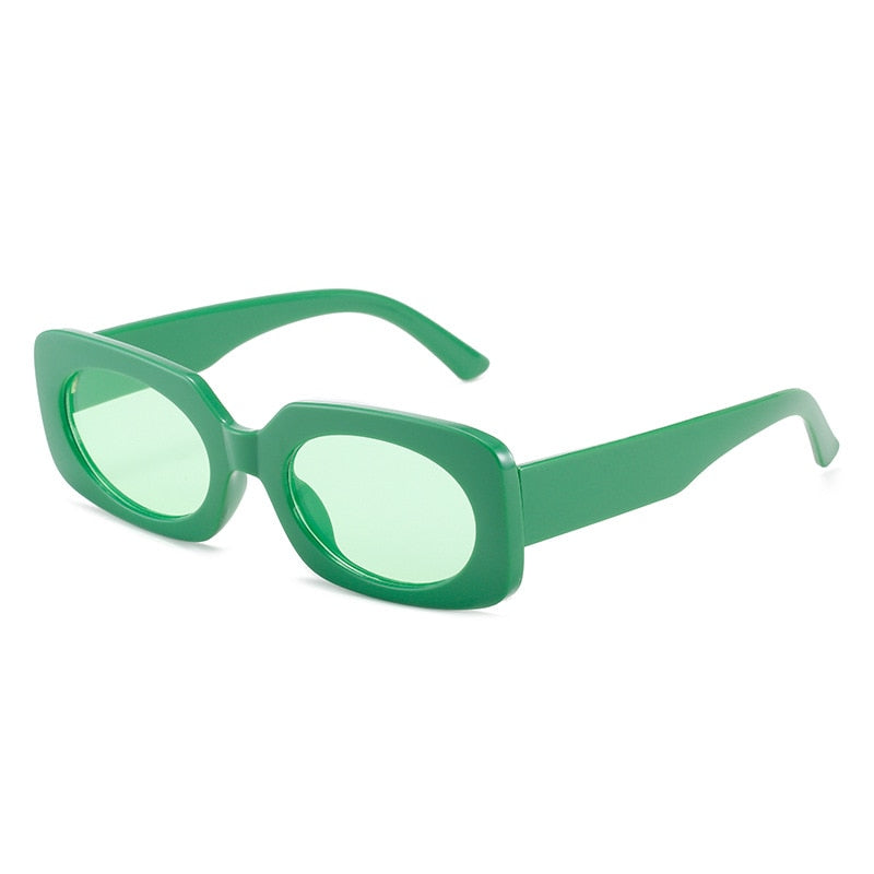 Playpark Atlas Sunglasses feature vintage style shapes and light green transparent lenses and solid green colour frames. Made from recycled materials and 400 UV protection.