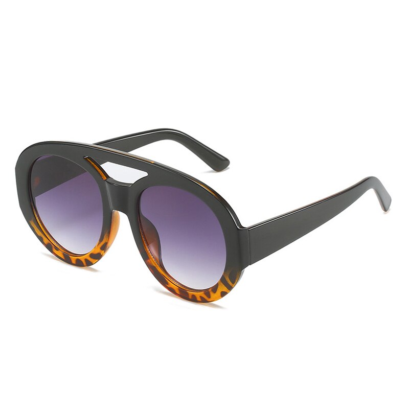 Playpark Arthur Sunglasses features a half black and torte shell ombre frame with a mix of solid and transparent colours. Clear lenses with 400UV protection and made from 100% recycled materials.