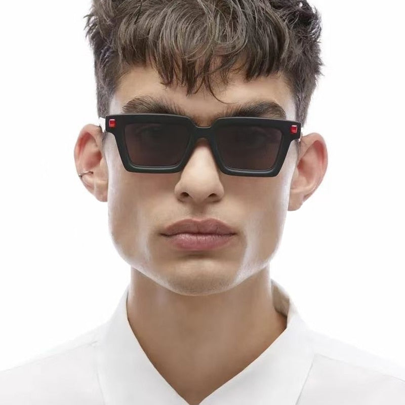 Playpark Studio modelling our Aaron Frame sunglasses in black and red.