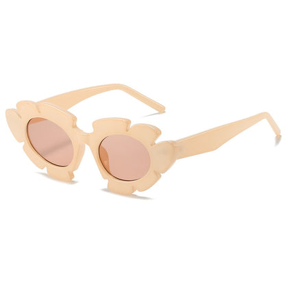 Flower inspired Playpark Bloom Sunglasses feature a beige floral frame with a cat eye style design. 400UV protection and made from recycled materials. 