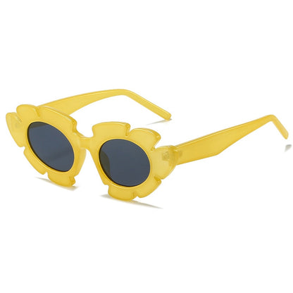 Flower inspired Playpark Bloom Sunglasses feature a yellow floral frame with a cat eye style design. 400UV protection and made from recycled materials. 