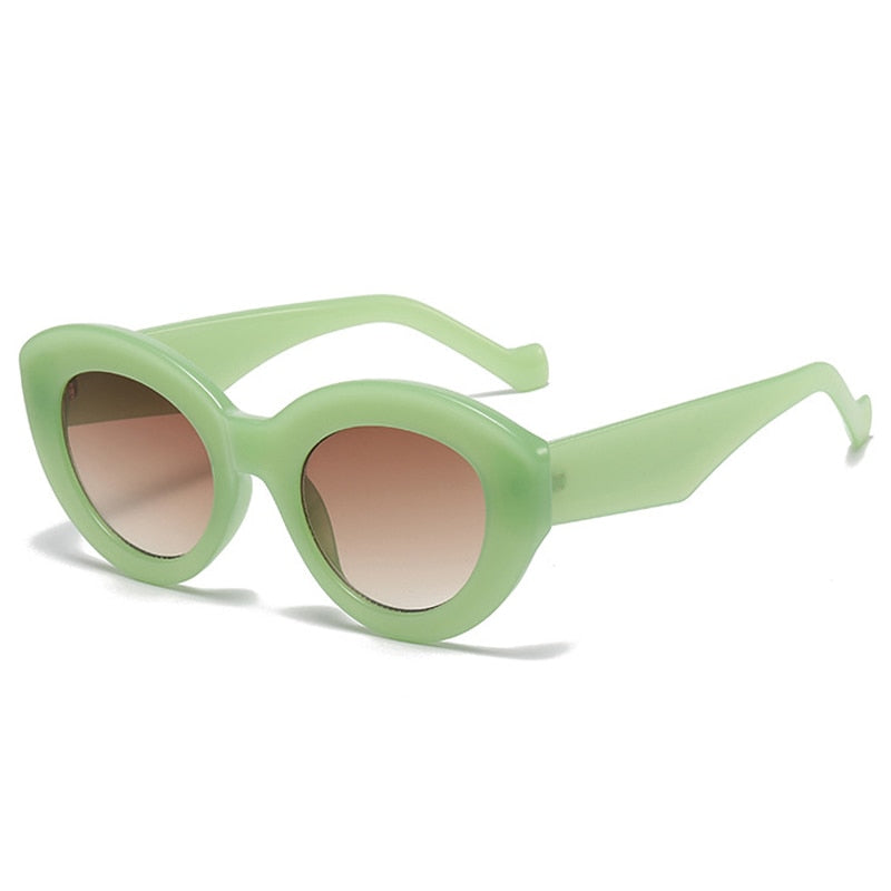 Playpark Claire Sunglasses feature a vintage cat eye with thick frames made from recycled materials and 400 UV protection - featured colour light green. 