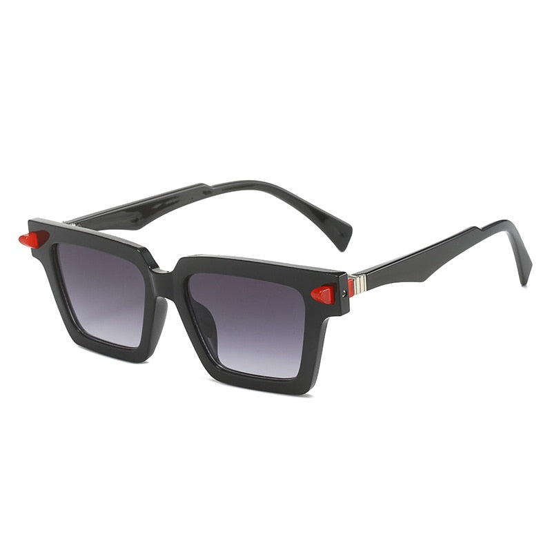 Playpark Sunglasses with ombre navy lenses and black frames with a red finish. The Lenses are transparent and the arms are black. UV 400 Protection and made from recycled materials.