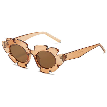 Flower inspired Playpark Bloom Sunglasses feature a tan transparent floral frame with a cat eye style design. 400UV protection and made from recycled materials. 