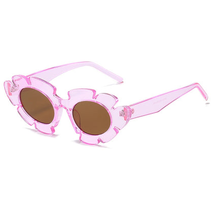 Flower inspired Playpark Bloom Sunglasses feature a hot pink transparent floral frame with a cat eye style design. 400UV protection and made from recycled materials. 