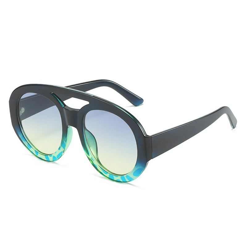 Playpark Arthur Sunglasses features a half navy and blue ombre frame with a mix of solid and transparent colours. Clear lenses with 400UV protection and made from 100% recycled materials.